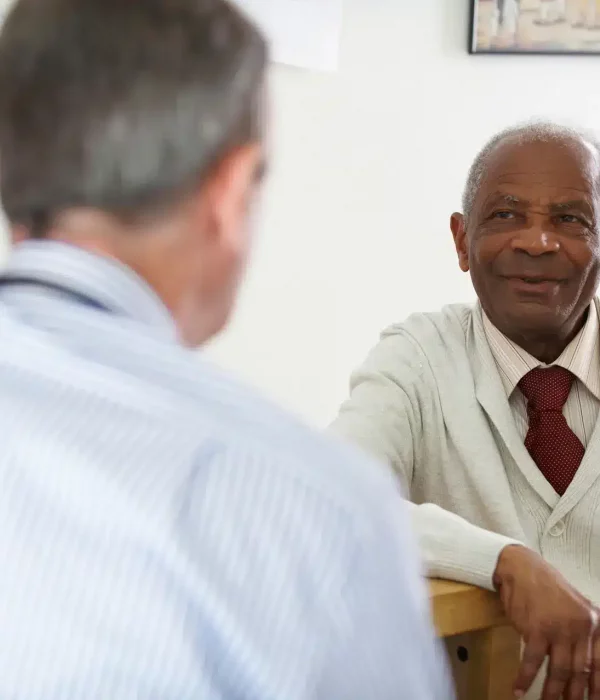 Social Worker talking to elderly man